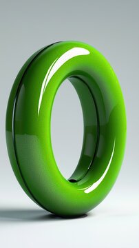 A vibrant green circular object with a glossy finish on a plain background