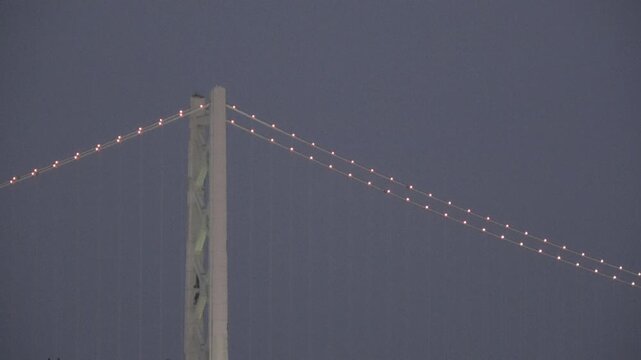Close-up of Akashi Kaikyo Bridge Main Tower and Illuminated Cables at Dusk