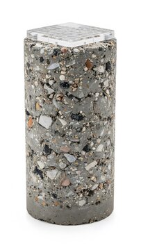 Vertical concrete cylinder sample with exposed aggregate and square grid pattern surface
