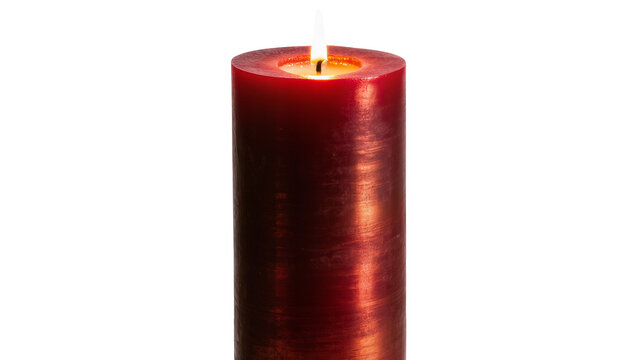 Isolated beautiful red pillar candle with a flickering flame providing warm and soft light.