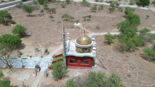 Rural Islamic mosque surrounded by the desert landscape in Sindh, Pakistan