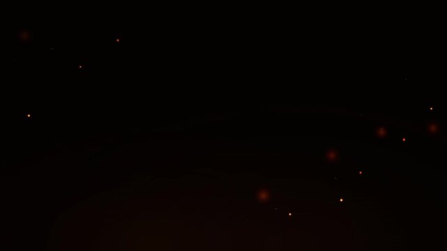 Glowing orange particles forming a circular path in the dark