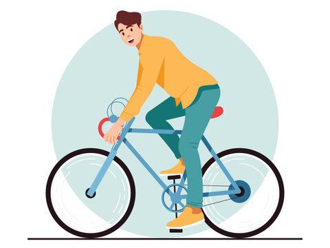 A happy young man riding a bicycle