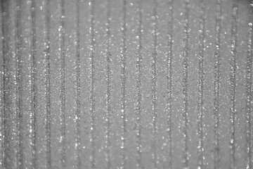 Krople rosy na poliwęglanie komorowym, dew drops on cellular polycarbonate, Striped carbonate with drops of dew on a sunny day. transparent roof. Bottom view. © kateej