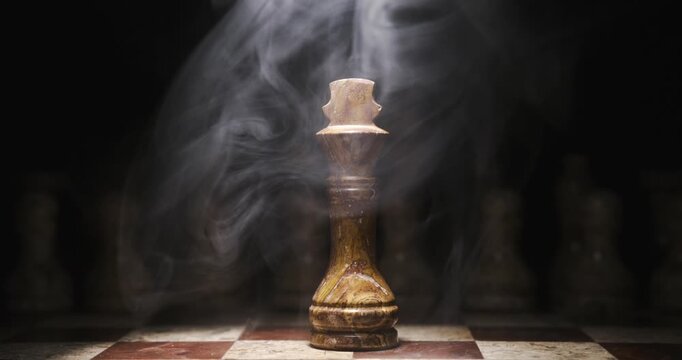 Chess king surrounded by smoke on a chessboard at night