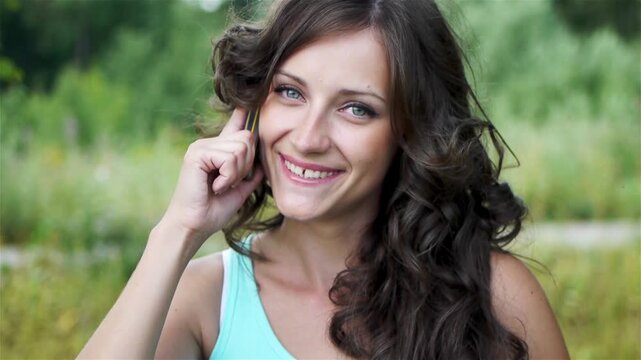 beautiful woman speaking on mobile phone