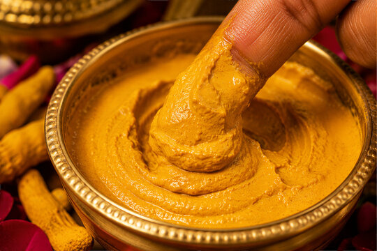Macro Close Up of Natural Turmeric Paste for Indian Haldi Wedding Ritual