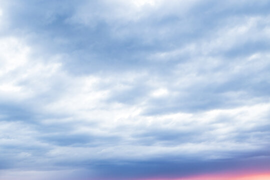 Voluminous Evening Clouds Bathed in Warm Sunset Glow