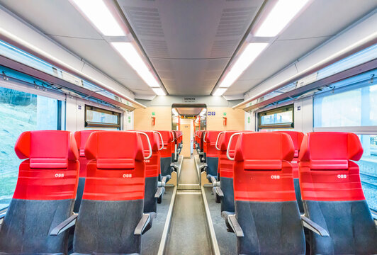 Interior view of a modern Austrian Federal Railways (OBB) regional train passenger car near Wolfsbergkogel along the historic Semmering railway line.