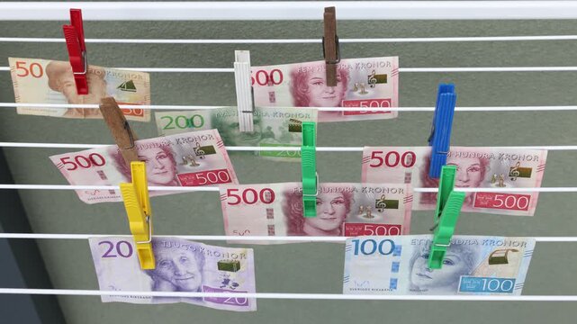 Money laundering. Joke concept. Hang up the laundry with banknotes. DIY make dirty cash clean. Video clip.