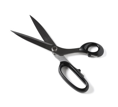 Black handled open scissors with sharp metal blades for cutting fabric or paper, isolated on a white background