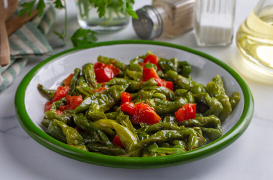 Traditional Turkish fried green peppers with tomatoes and olive oil