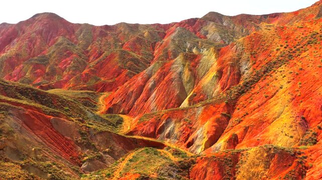 Aerial view of colorful stratified Danxia landforms in Gansu, natural geological landscape
Rainbow layered rock hills formed by millions of years of erosion and tectonic movement