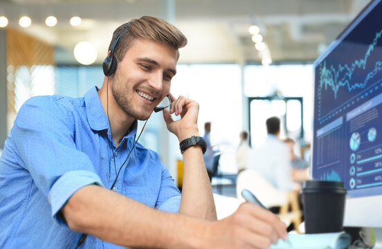Smiling friendly handsome young male call centre operator