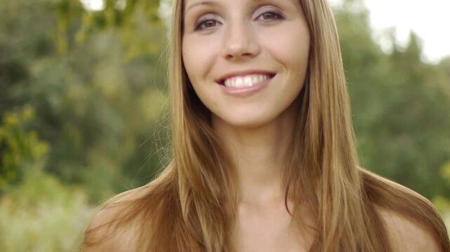 woman holding an red apple and smiling