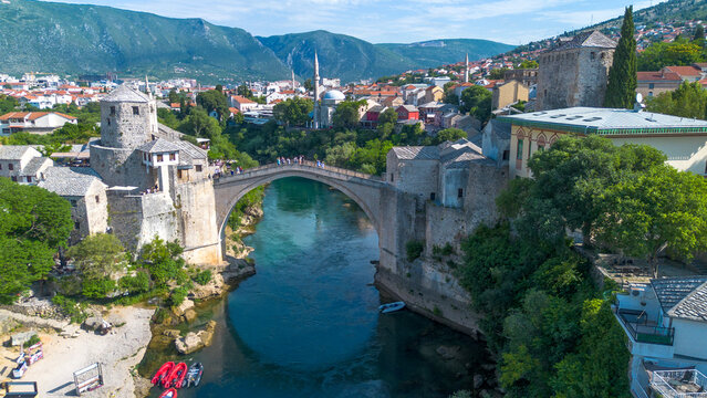 Top down aerial drone view of the historic Stari Most Mostar Old Bridge over Neretva river in Bosnia and Herzegovina