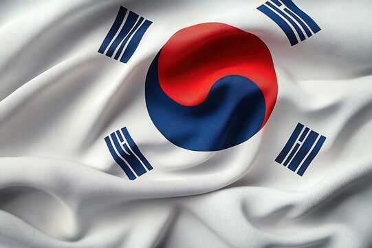Waving white flag with central red and blue circular symbol and four black trigrams, textured fabric conveying national pride and unity