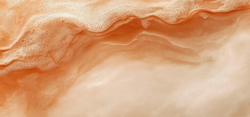 Fototapeta premium warm orange and cream marble-like texture with foamy bubbles, flowing waves and smooth swirls, evoking calm organic fluid motion