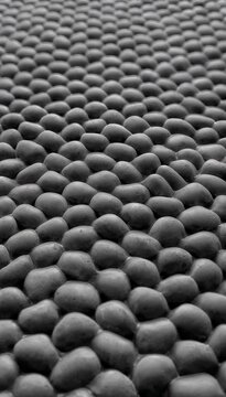 Rounded ceramic cells breathe rhythmically while preserving continuous seamless contact across mesmerizing abstract surface throughout
