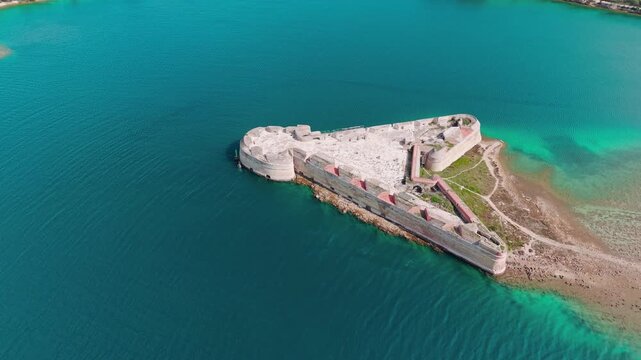 aerial view of St. Nicholas Fortress (Tvrđava Sv. Nikole), &Scaron;ibenik, Croatia, historic triangular sea fort surrounded by deep blue and turquoise Adriatic Sea