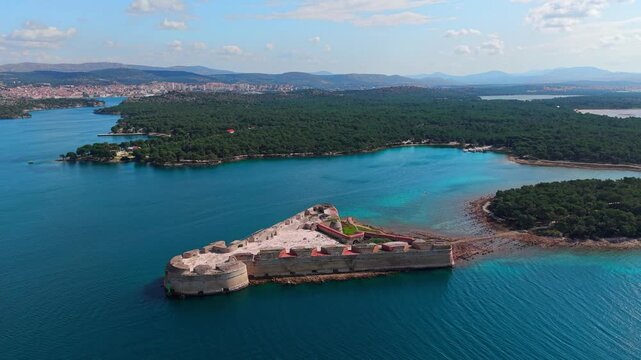 aerial view of St. Nicholas Fortress (Tvrđava Sv. Nikole), &Scaron;ibenik, Croatia, historic triangular sea fort surrounded by deep blue and turquoise Adriatic Sea