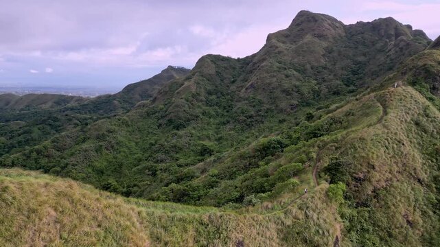 Scenic Ridge With Misty Skies. Breathtaking Journey Across Rolling Hills And Foggy Mountain Peaks