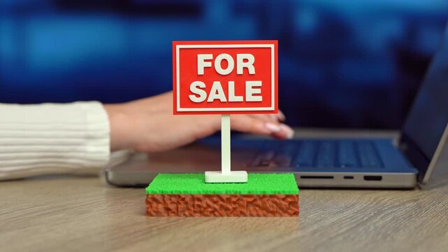 A plot of land is for sale. The plot area has a green lawn and a For Sale sign. Real estate opportunities support investment, development and property ownership.
