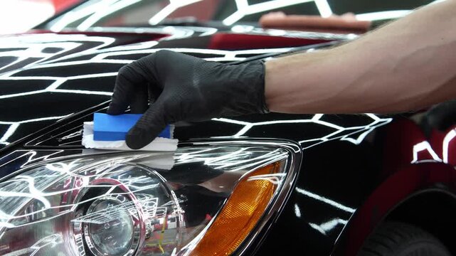 Ceramic Coating Application 4k video. Applying liquid glass sealant to black car hood for scratch resistance. Applying ceramic paint protection to restore and preserve vehicle aesthetics