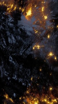 The bright lights of cities and towns at night. The image captures the land and part of the ocean from space. Stars and clouds are visible in the background.