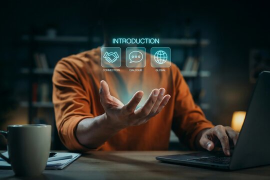Person using laptop with holographic introduction icons for business communication setup