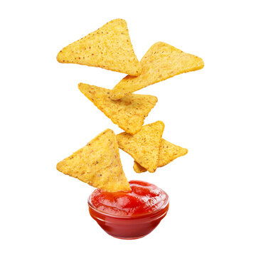 Delicious tortilla chips falling into tomato sauce, isolated on transparent cutout background