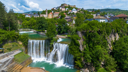 Naklejka premium Aerial Panorama of Historic Jajce Town with Pliva Waterfall and Fortress in Bosnia and Herzegovina