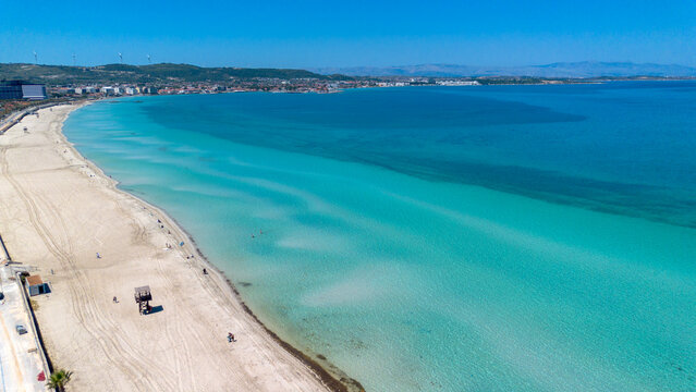 Aerial view of the long white sand beach and turquoise sea in Ilica Cesme Izmir Turkey