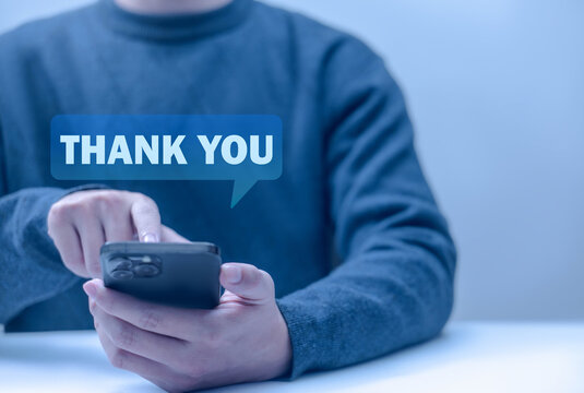 The concept of gratitude in business. Displaying thank-you messages from a smartphone. A digital presentation. A gift of gratitude.