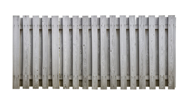 Isolated old weathered wooden picket fence structure, rustic gray timber wall section