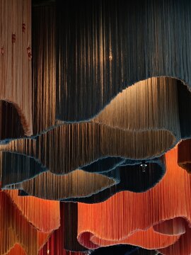 Dramatic Hanging Thread Art Installation with Dark Teal and Orange Layers