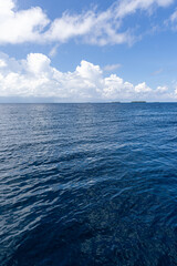 Inspirational ocean view, deep blue sea, sky clouds, calm open horizon. Beautiful tranquil nature seascape, peaceful relaxing water scene. Meditation wellbeing background, serene nature wallpaper  © icemanphotos
