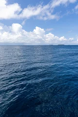 Inspirational ocean view, deep blue sea, sky clouds, calm open horizon. Beautiful tranquil nature seascape, peaceful relaxing water scene. Meditation wellbeing background, serene nature wallpaper  © icemanphotos