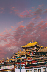 Obraz premium Songzanlin Monastery at sunset with golden light, Shangri-La, Tibet, China