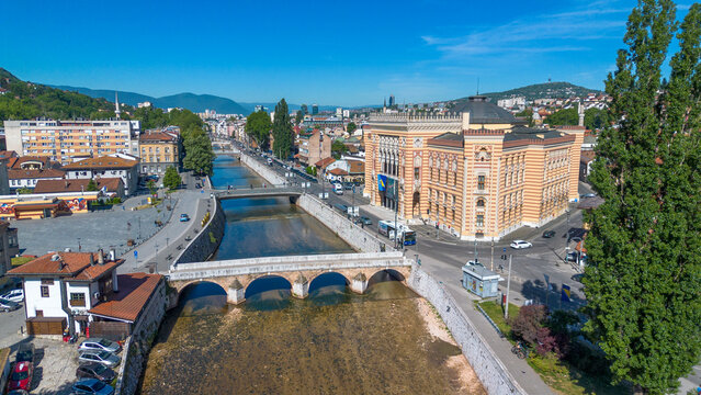 Drone view of Sarajevo City Hall Vijecnica and historic Latin Bridge over Miljacka river