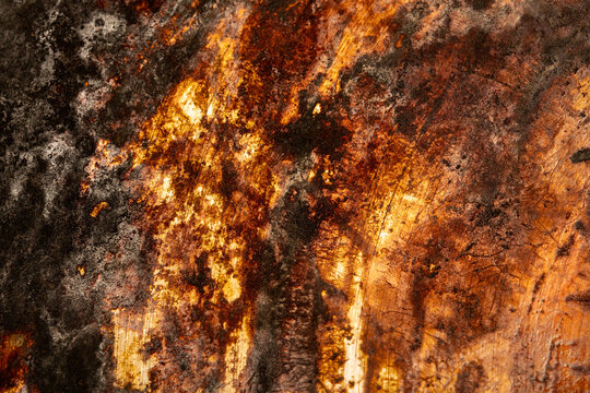 Close-Up of Burnt and Chatted Metal Surface with Rust Textures