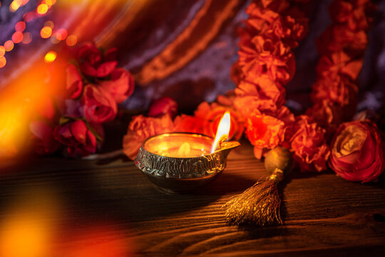 Diwali lamp diya or Deepavali or Deepawali. Hindu festival of lights. Celebrating in Indian religions Jainism and Sikhism. Offering to the gods, a spiritual rite. Close up view, out of focus