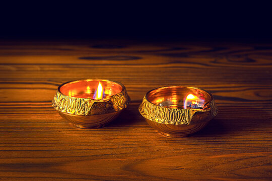 Diwali lamp diya or Deepavali or Deepawali. Hindu festival of lights. Celebrating in Indian religions Jainism and Sikhism. Offering to the gods, a spiritual rite. Close up view, out of focus
