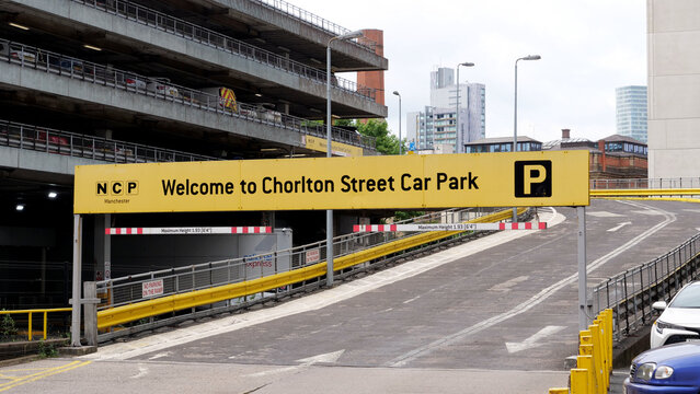 Manchester, England, UK - 18 June 2026: NCP Chorlton Street Car Park entrance ramp with yellow welcome sign, multi storey parking garage structure in Manchester city center, United Kingdom