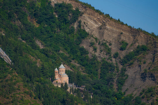 Ancient Tabori monastery on steep mountain slope in Tbilisi with copy space