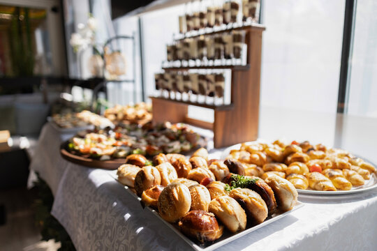 Buffet catering service offering various appetizers, snacks, canap&eacute;s, and mini sandwiches for events and parties