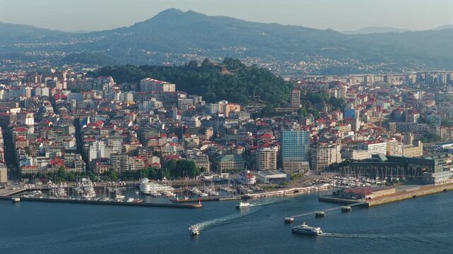 Aerial Drone View of Passenger Ferries Navigating the Ria de Vigo Estuary at Sunset After Departing the Cies Islands