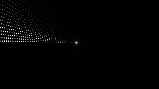 Light emerging from a dark tunnel with dot patterns on the wall