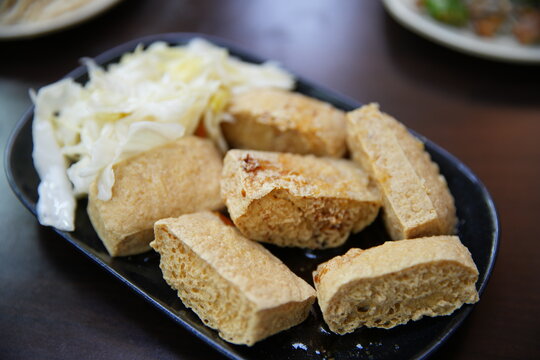 Taiwanese traditional stinky tofu served with pickled cabbage.