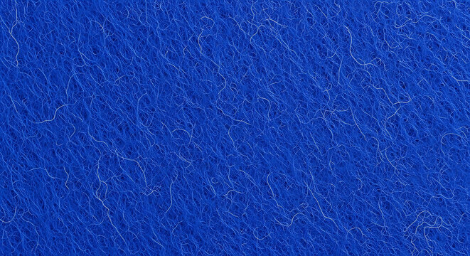 Close up of vibrant blue texture and fiber detail on a soft felt fabric textile background
